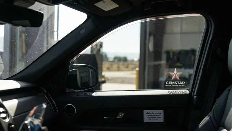 A professionally tinted vehicle with ceramic window film parked in the Idaho sunshine showing clean installation and heat rejection